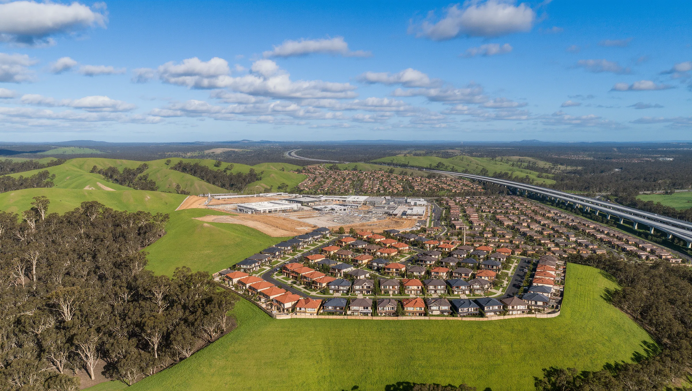 Aerial view over the Merrifield West precinct at golden hour